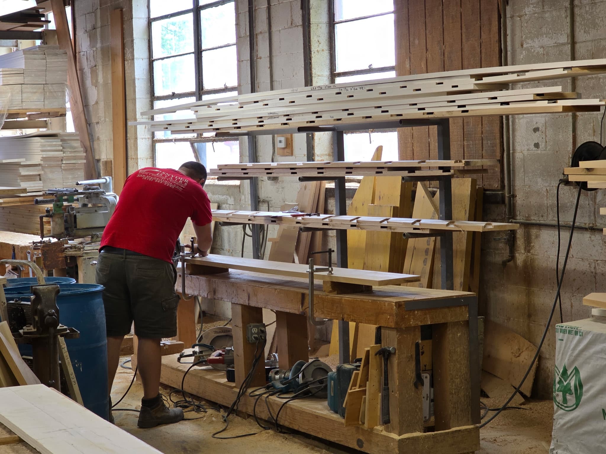 A Snyder craftsman fitting stair stringers on the Whitehall build floor