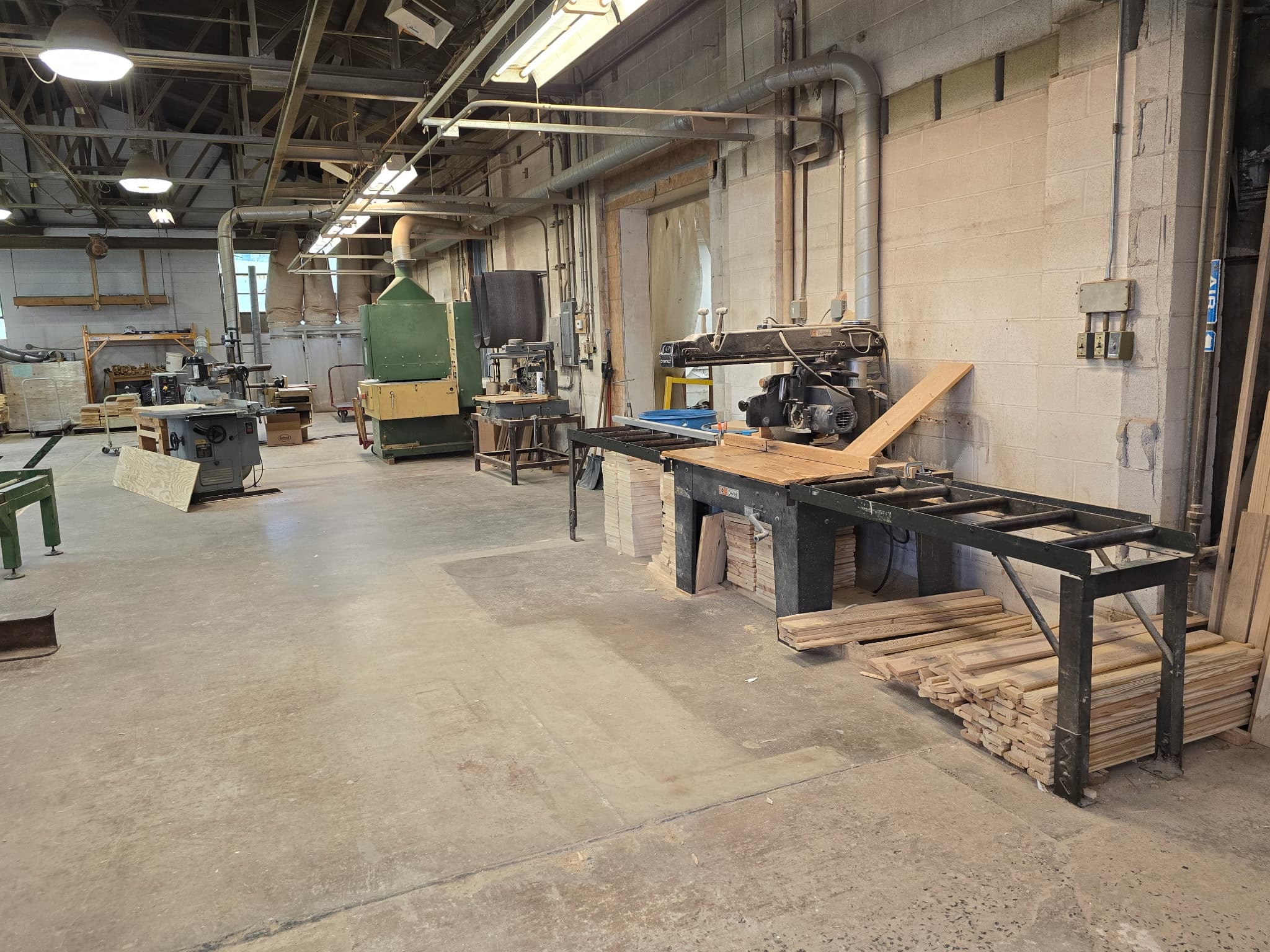 Snyder Stairs showroom — newels, balusters, and stained wood samples on display