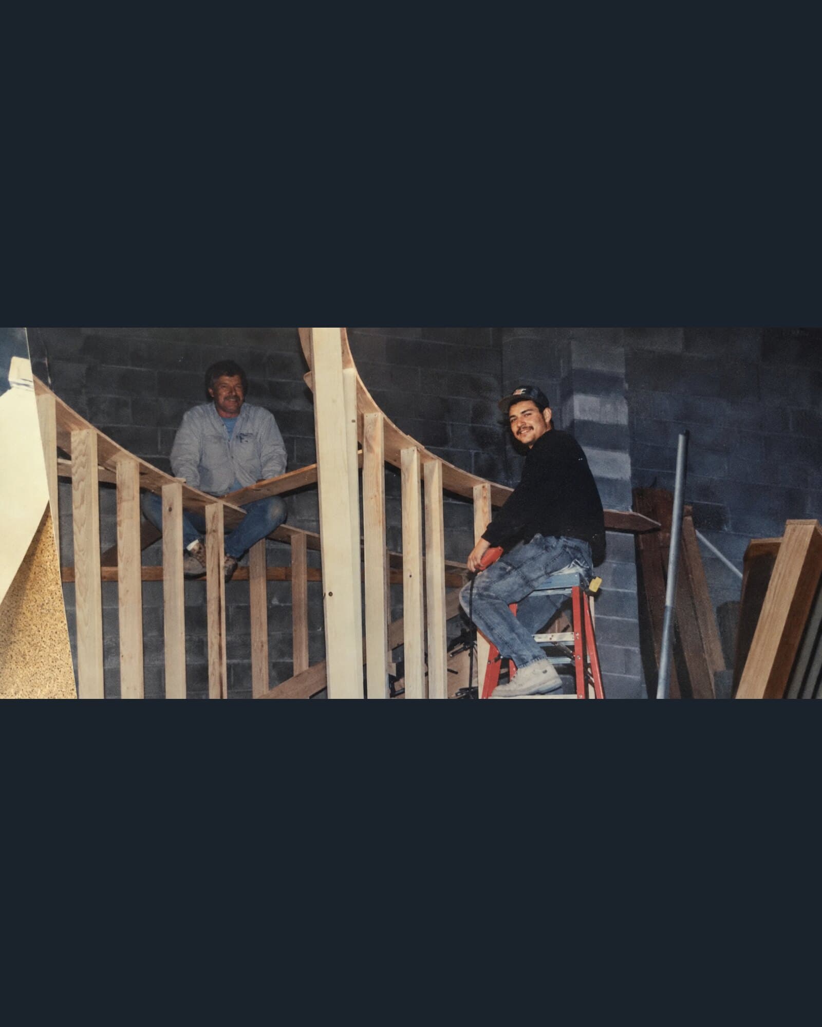 Two generations of the Snyder family on a curved stair build in the early Snyder Stairs shop