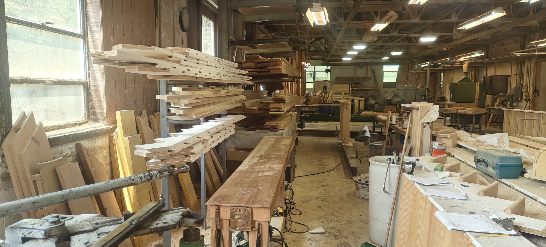 Snyder Stairs shop floor in Whitehall — racked tread stock and workbenches