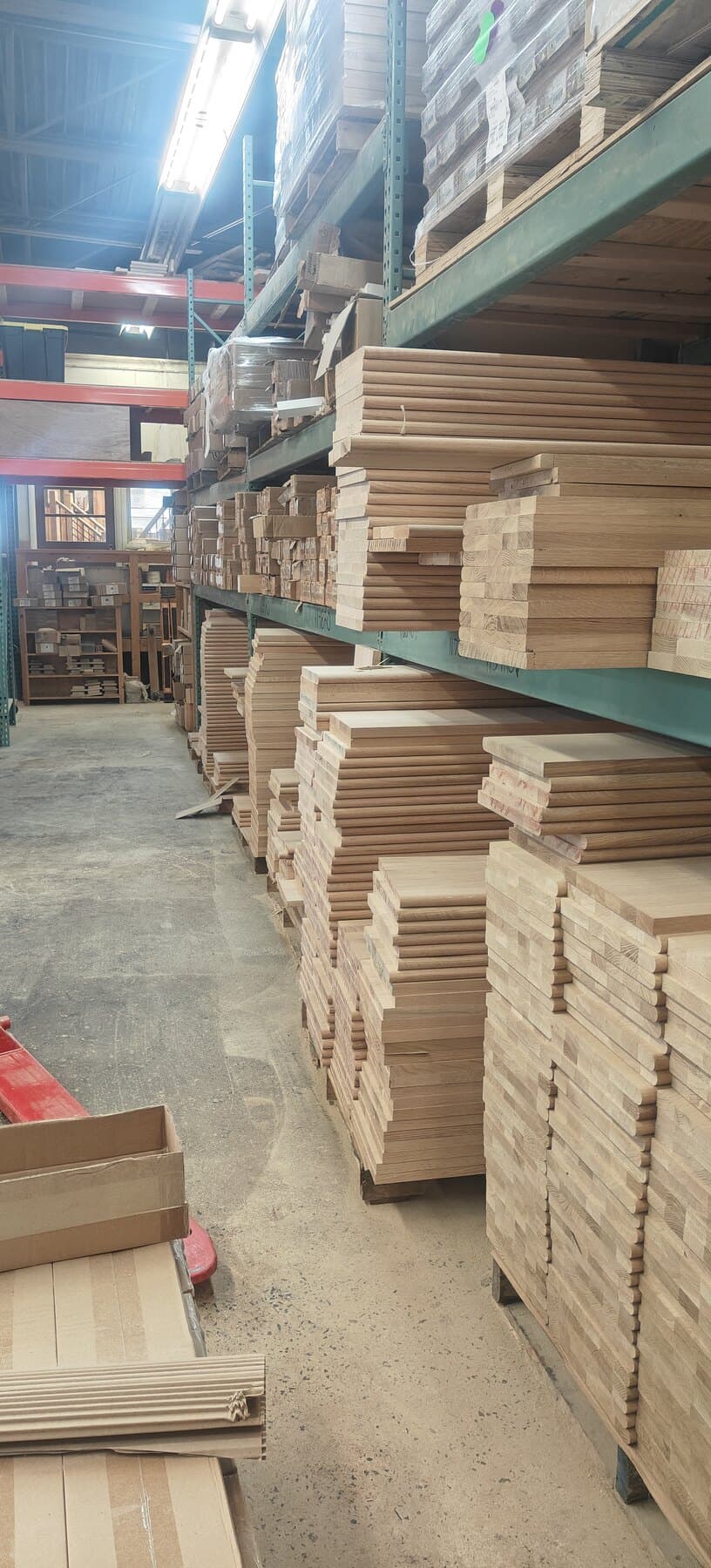 Hardwood tread and riser stock racked in the Snyder Stairs Whitehall shop
