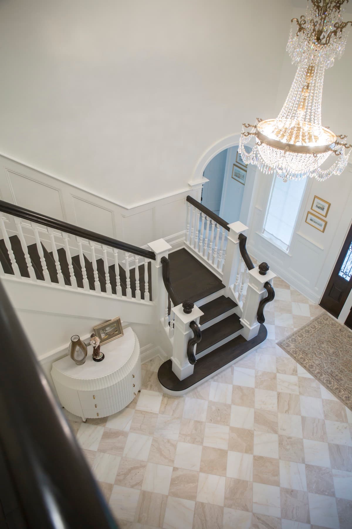 Overhead view into the Caruso foyer with marble checkerboard floor