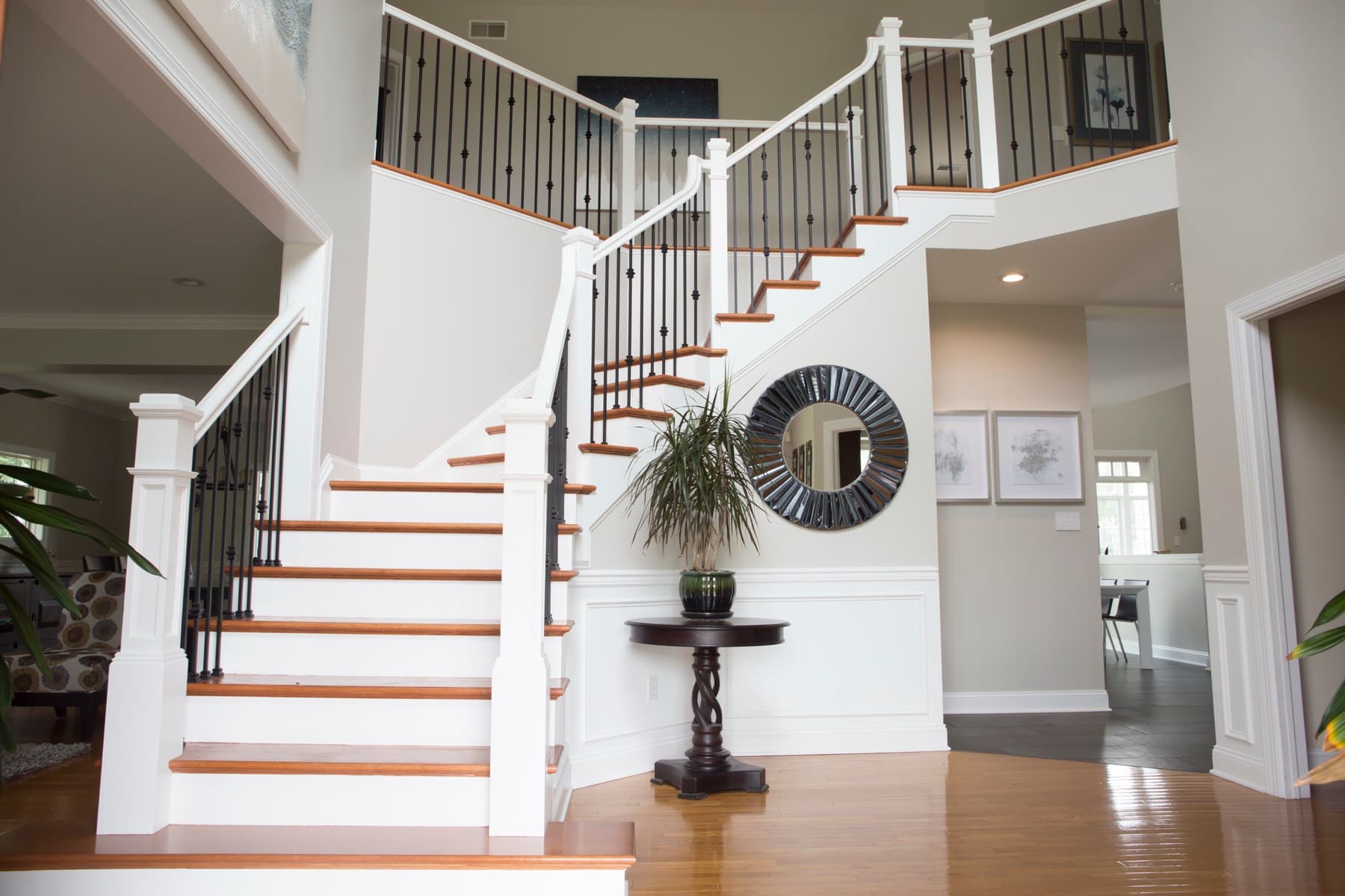 New white-oak treads matched to wide-plank floors — Center Valley