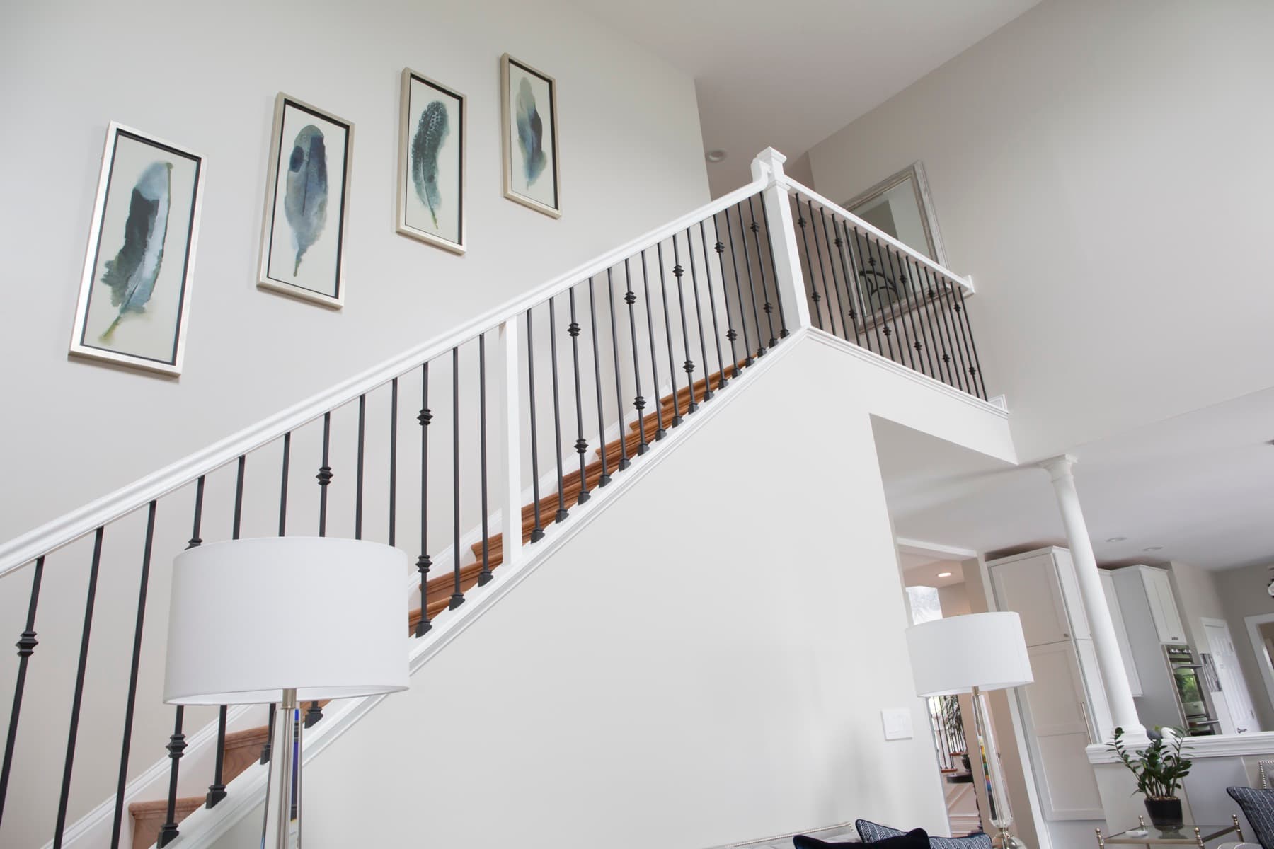 A finished Snyder staircase with iron balusters installed in a Lehigh Valley foyer.