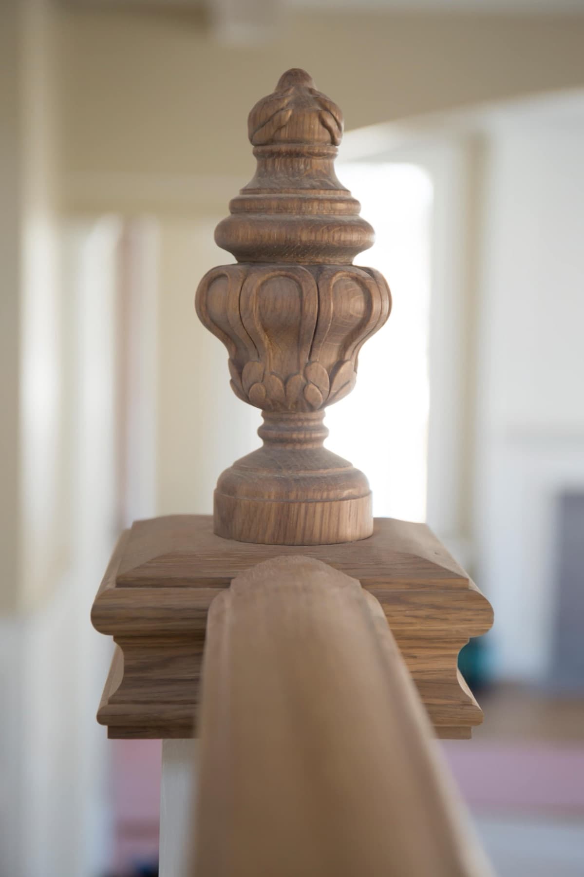 Foyer with oak treads and turned white balusters — Faucett period restoration