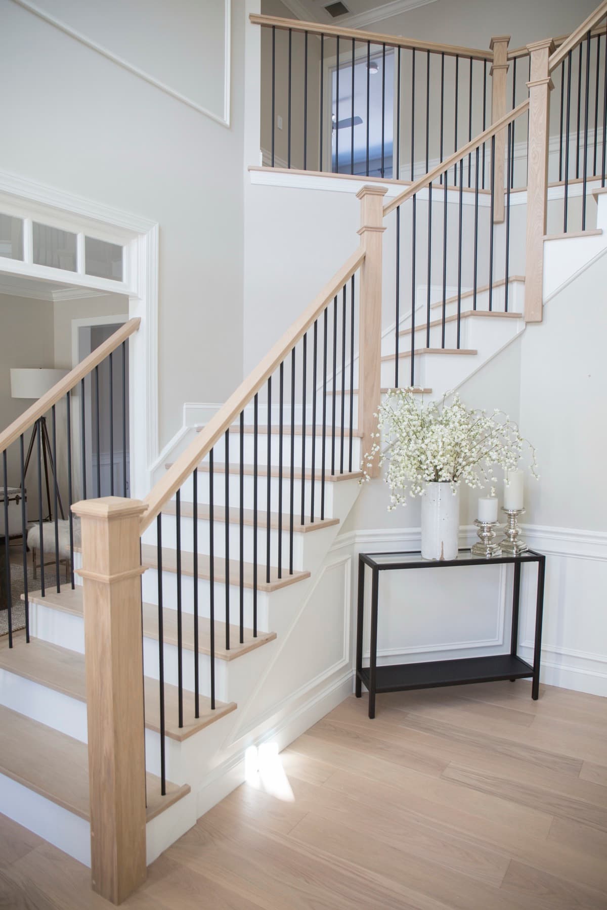 Updated stair railing with iron balusters and a walnut handrail — Modern White Oak project, Allentown
