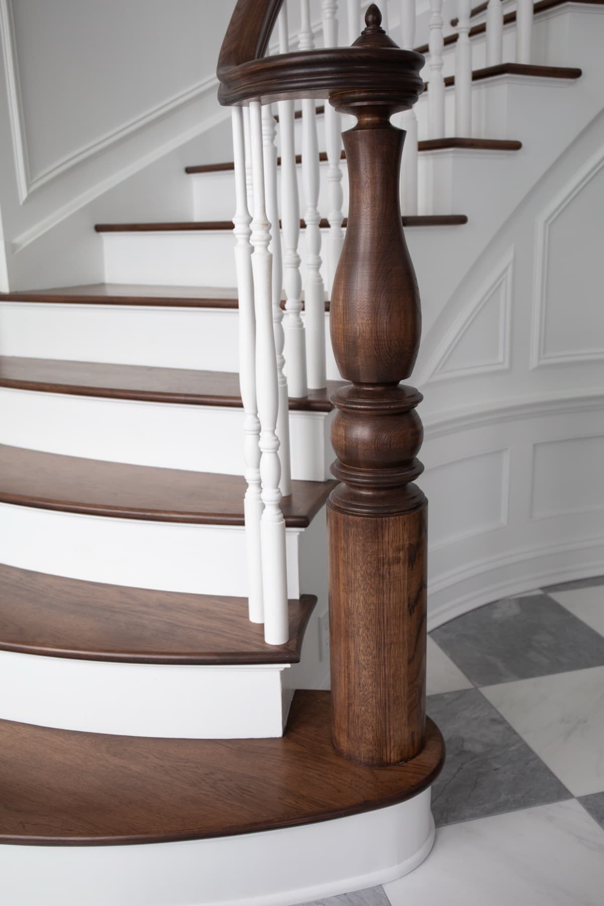 Shaped walnut handrail with carved newel — Rambo residence