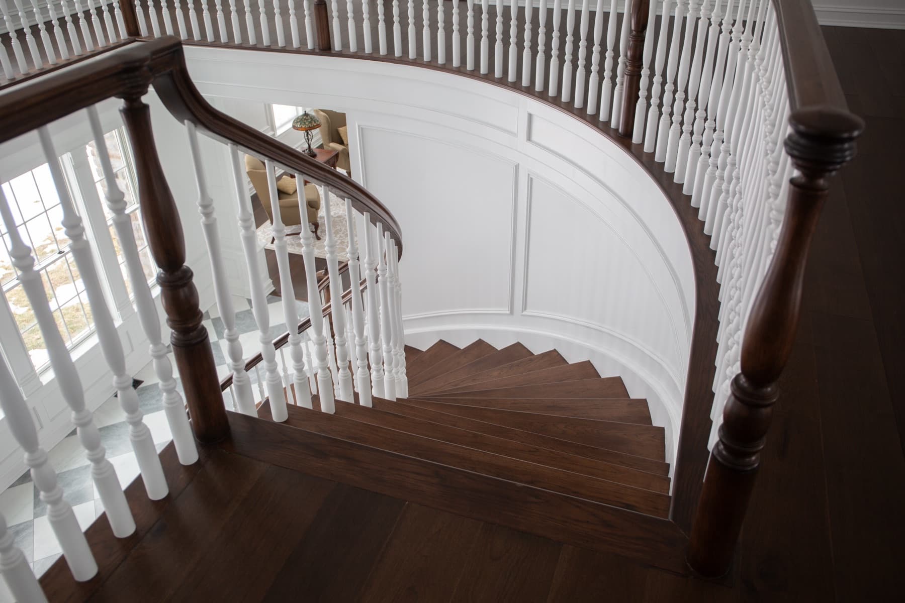 Field-measuring a stair opening during framing.