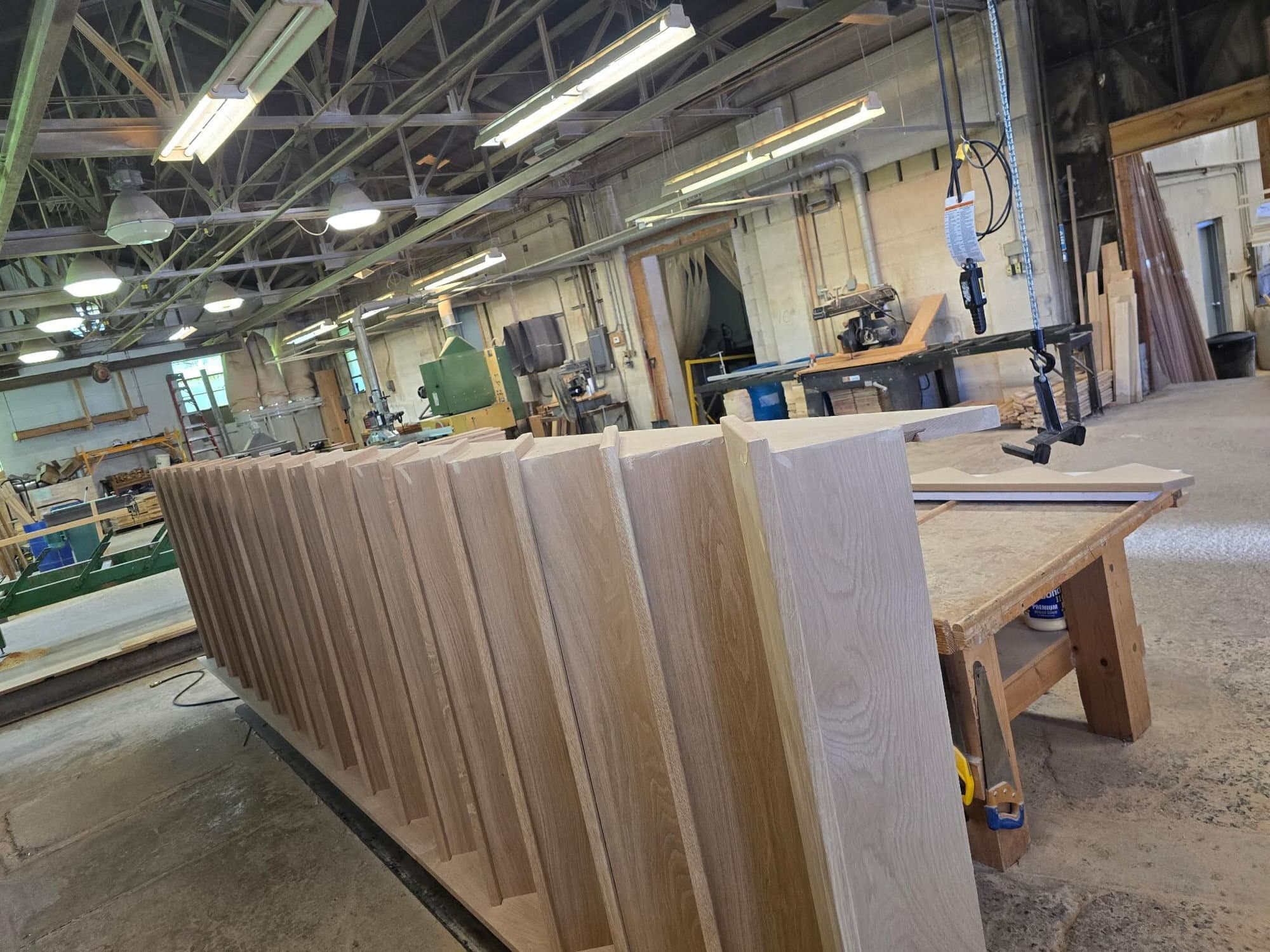 Cut stair stringers stacked on the Snyder Stairs shop floor in Whitehall, PA